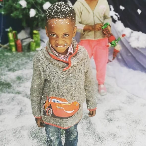 A pupil covered in artificial snow at the Christmas display