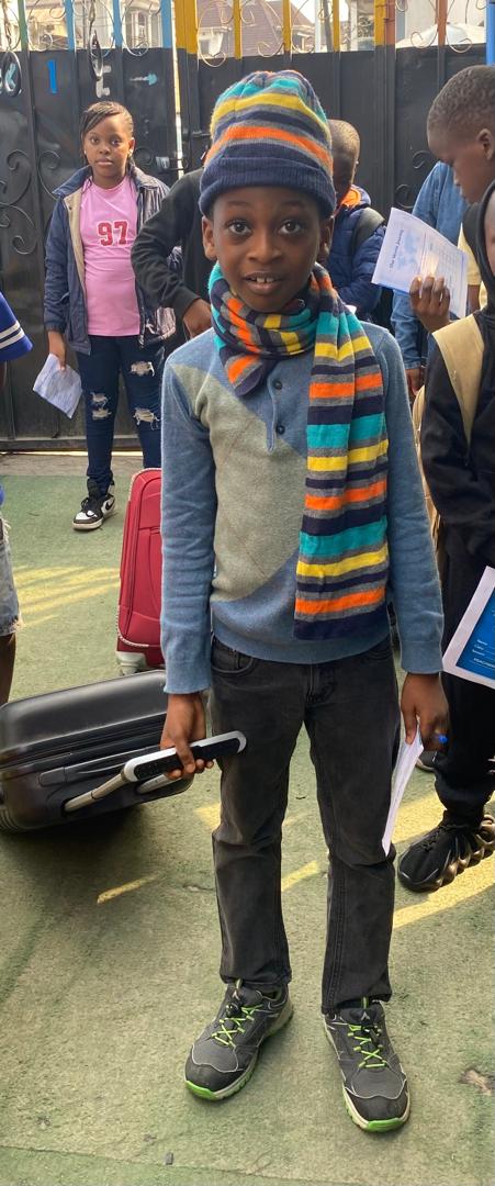 A pupil bundled up for Global Tour Passport Day