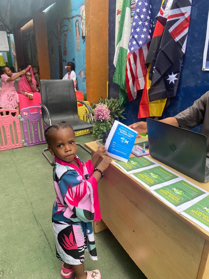 A young pupil at the Global Tour Passport check-in desk