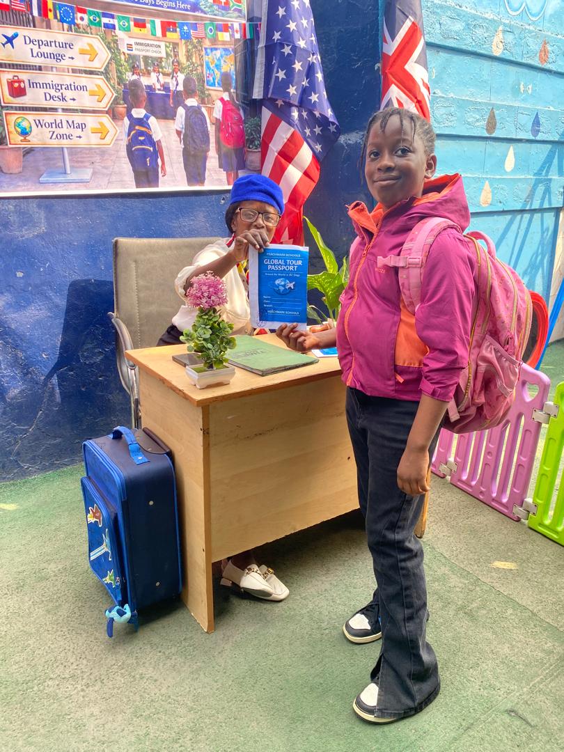 A pupil having her passport stamped at the Immigration Desk