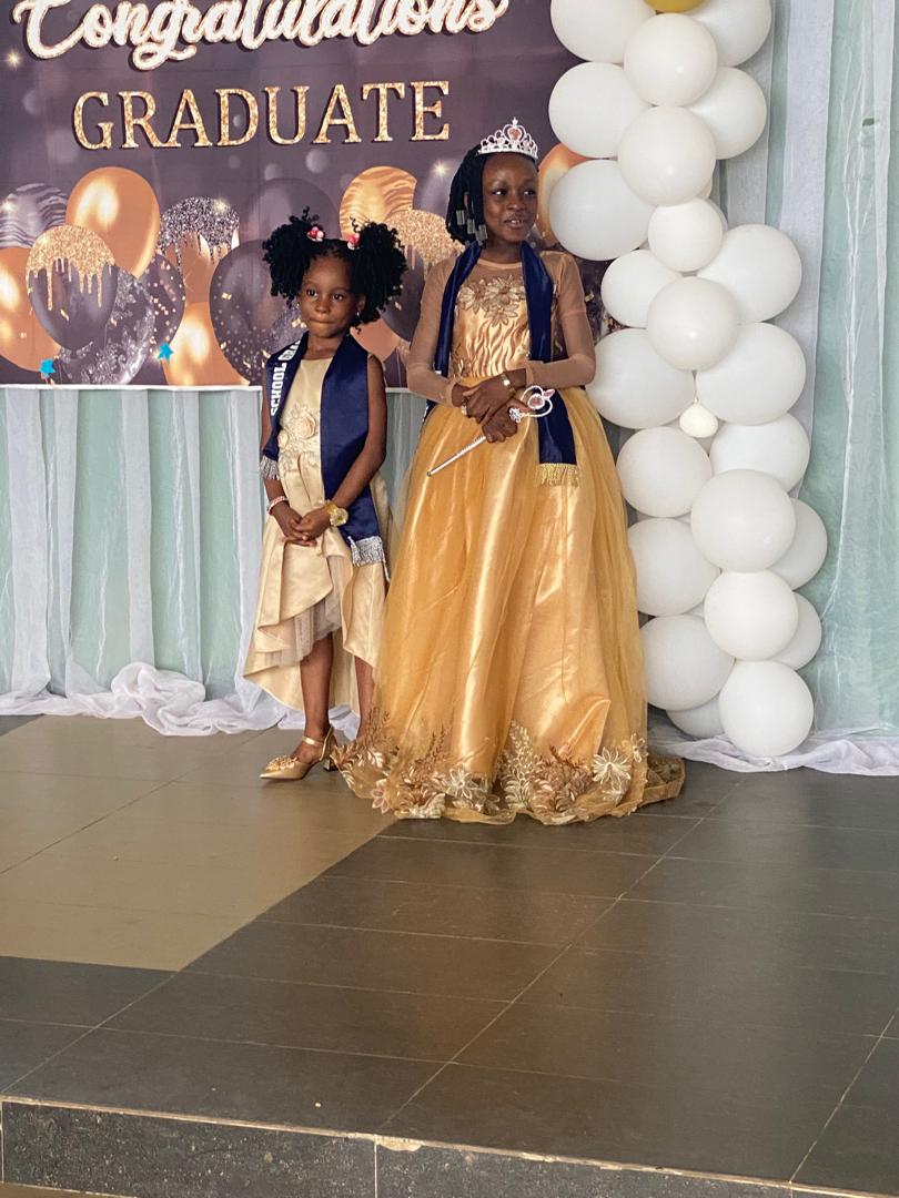Peachmark graduates in gowns and sashes