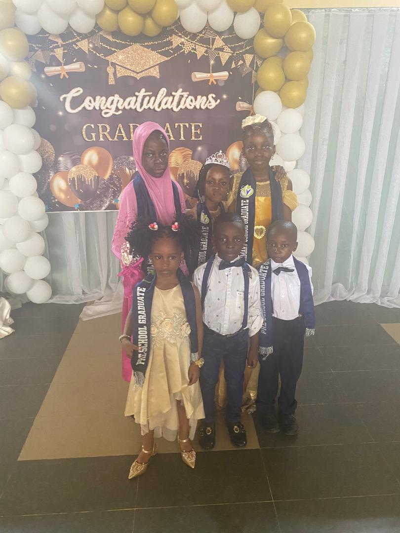 Peachmark graduates in sashes at the Congratulations Graduate event