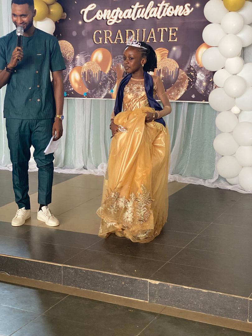 A graduate walking the stage as her name is announced