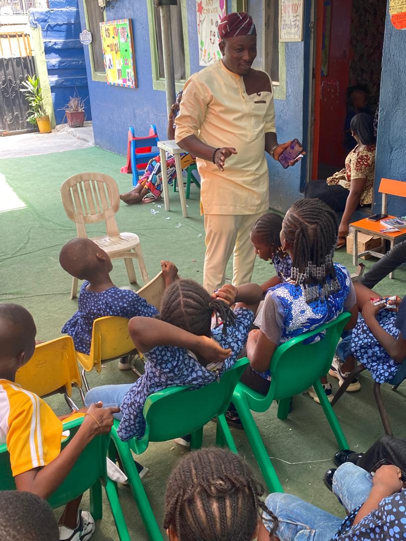 A Peachmark staff member engaging with pupils outdoors